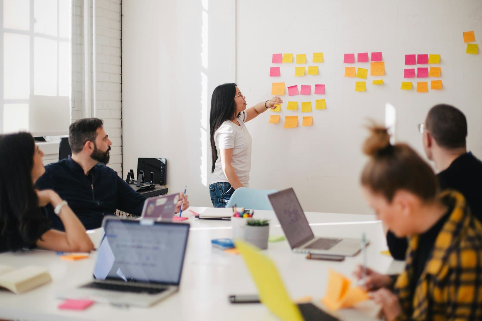 Business leader presenting growth plans to a team
